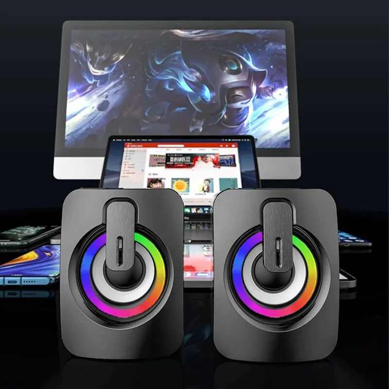 3D Stereo Mini Computer Speaker with vibrant LED lights on a desk setup.